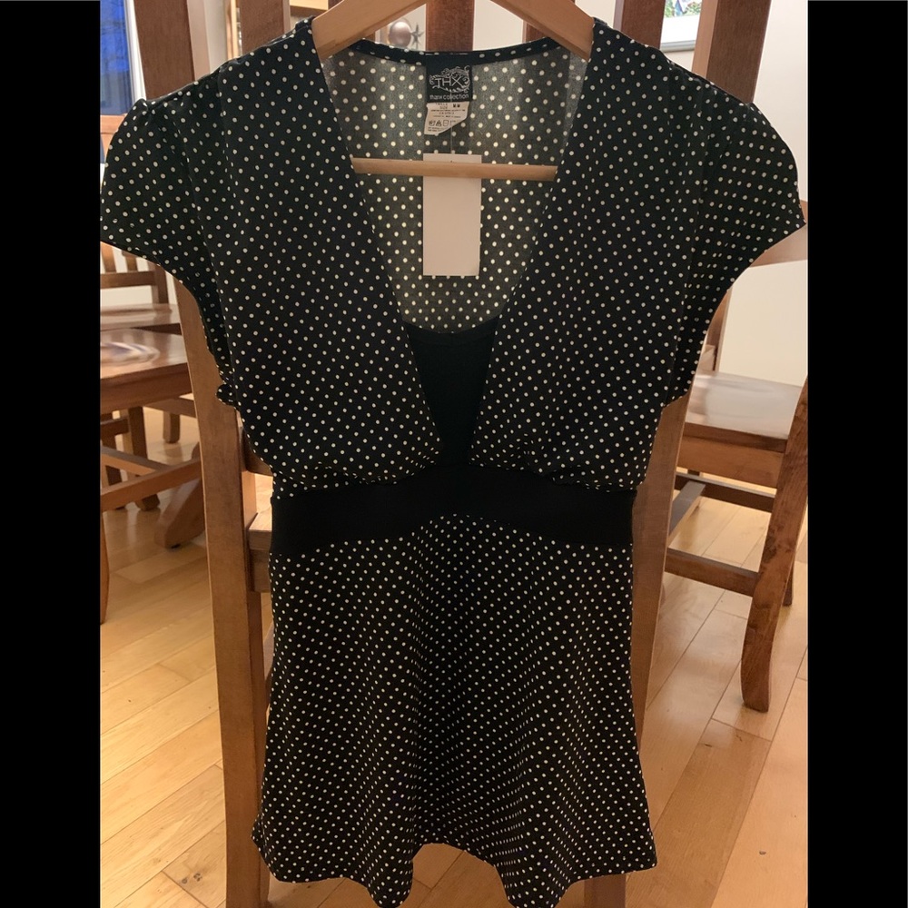 Get ready for spring with this beautiful Thx shirt/blouse!